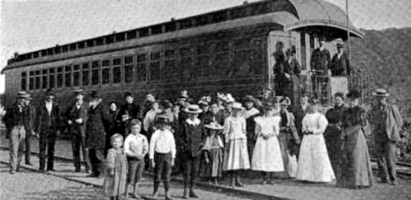 photo of chapel car with parishioners in front